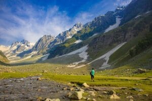 Man Walking in Sonamarg Valley Sourrounded by Mountains, Kashmir