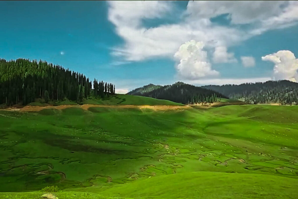 A mesmerising view of Bangus Valley with green meadows, dense forests and distant mountains