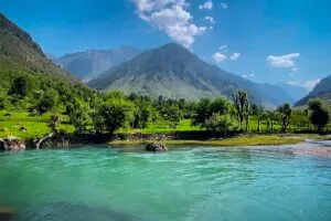 Mesmerising view of Betaab Valley, blue Lidder River water, green trees, and a Mountain