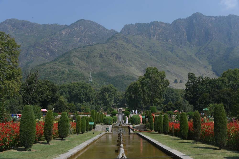 View of Nishat Garden fountains and terraced lawns in spring against Zabarwan Mountains in Srinagar